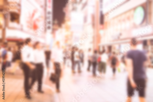 Blurred image of people shopping with vintage color effected