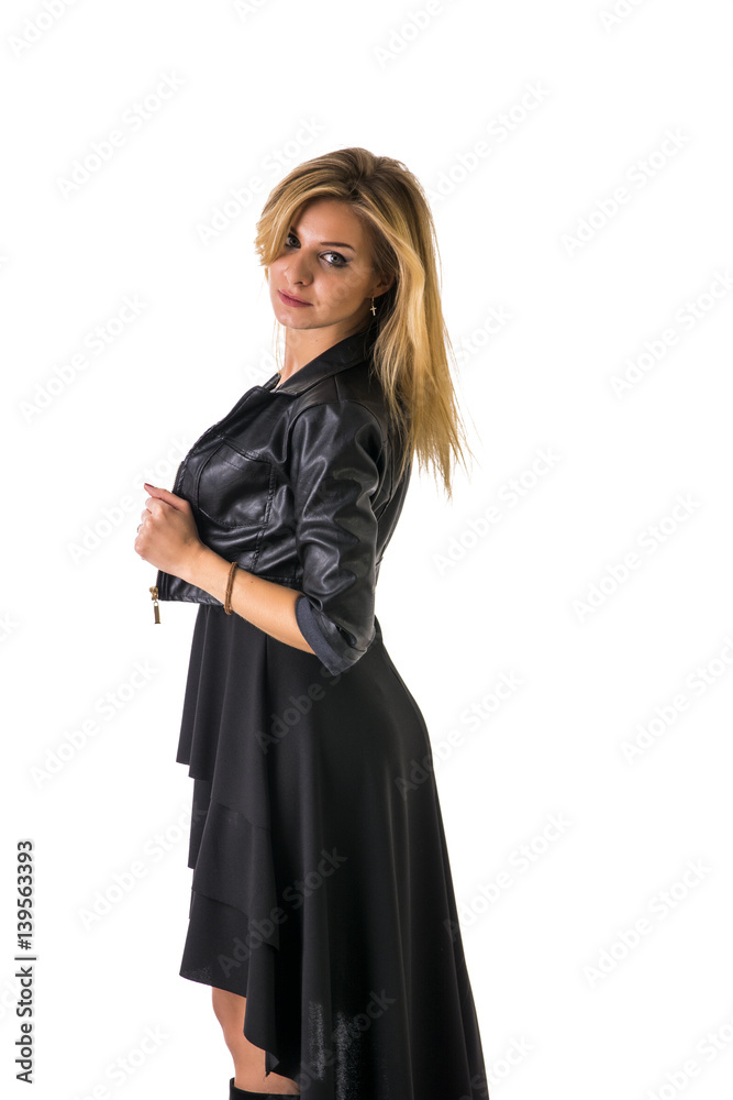 Portrait of attractive blonde woman in black skirt and leather jacket looking at camera in studio shot, isolated on white background Portrait of attractive blonde woman in black skirt and leather jacket looking at camera in studio shot, isolated on white background