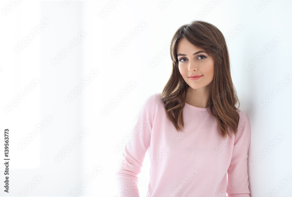 Portrait of beautiful smiling woman with crossed arms on white background Portrait of beautiful smiling woman with crossed arms on white background