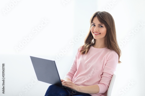 Smiling beautiful woman portrait with laptop