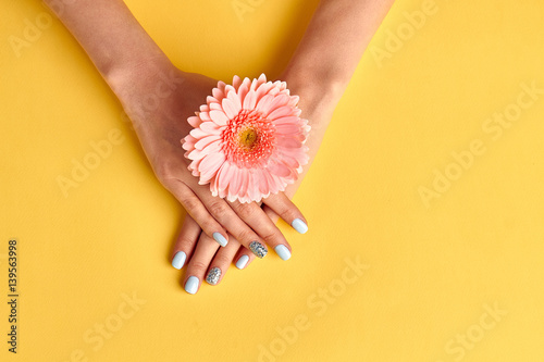 Beautiful nails with blue manicure. Beauty salon.
