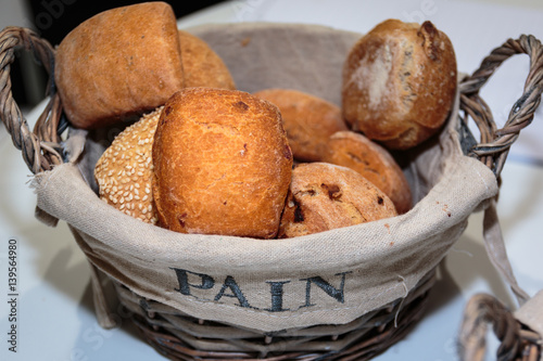 Heap of Bread Rolls Assortment inside Wicker Basket