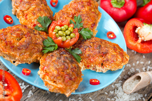 Red bell pepper paprika rice meatball baked in sauce photo