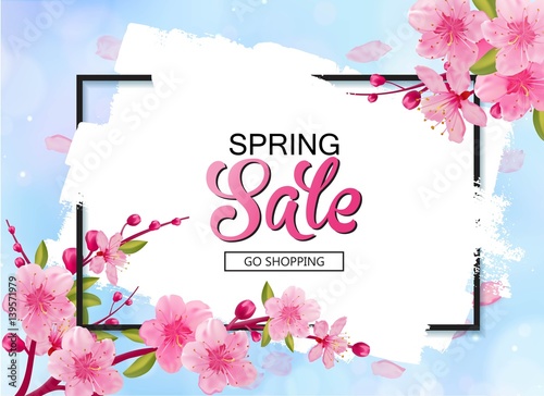 Spring sale vector banner design with flowers and frame. Cherry blossoms and blue sky background.