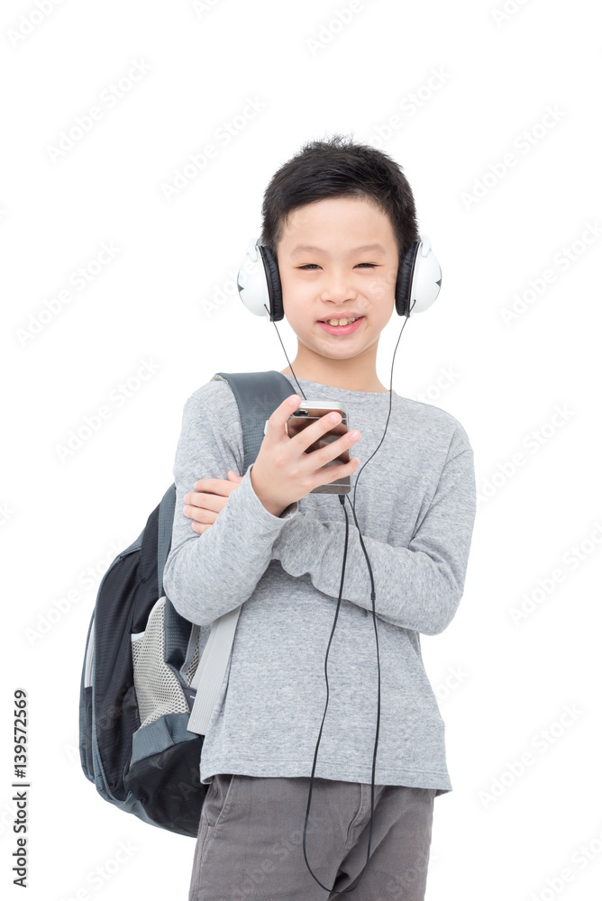 Young asian boy with backpack and headphone over white Young asian boy with backpack and headphone over white