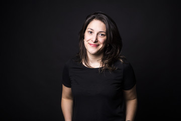 young caucasian woman portrait on black background