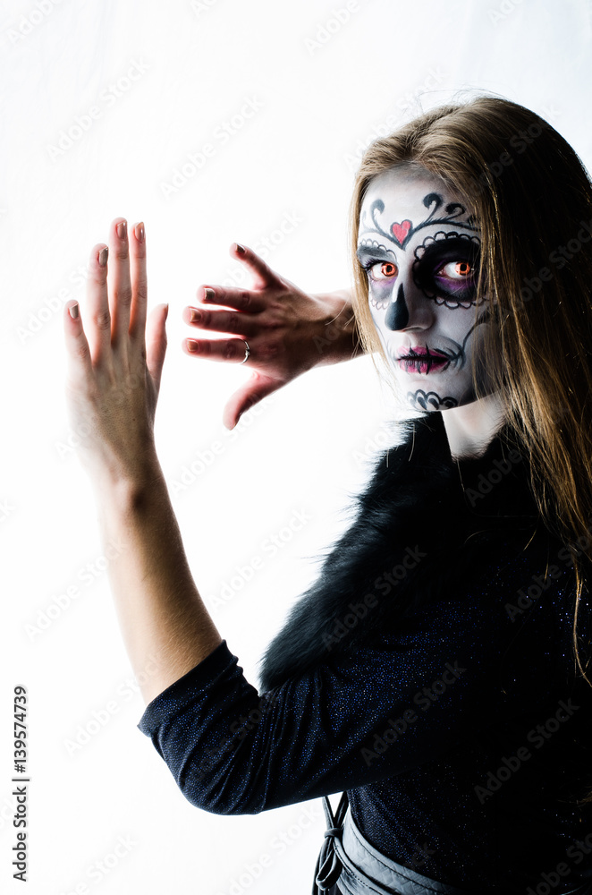 girl in a make-up posing in studio Halloween