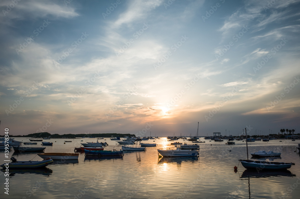 Small boat harbour at sunset, Apulia, Italy.