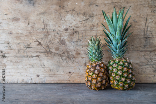 Ripe pineapples on a wooden table