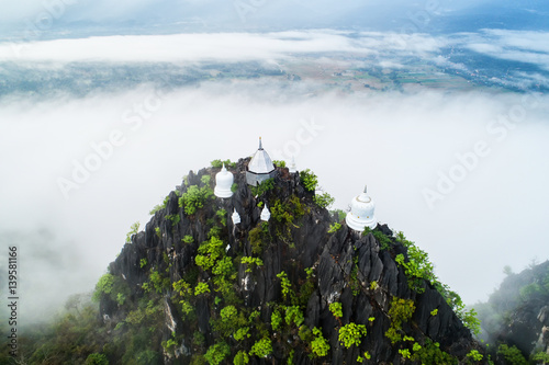 Fog on the Mountain.Wat Mongkut Memorial Rachanusorn a public temple on the hill. The wonderful thing is beautiful. It is located in Lampang, Thailand. photo