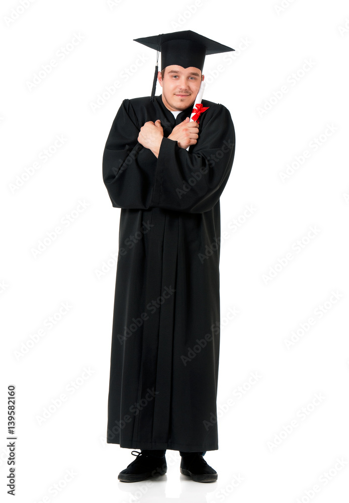 Handsome graduate guy student in mantle with diploma, isolated on white background Handsome graduate guy student in mantle with diploma, isolated on white background