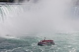 Beautiful isolated photo of a ship near amazing Niagara waterfall