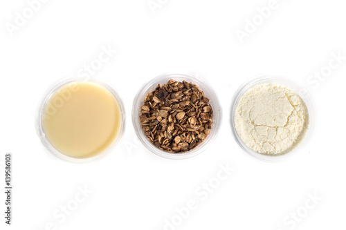 Acai cream side dishes in bowls isolated over white background.