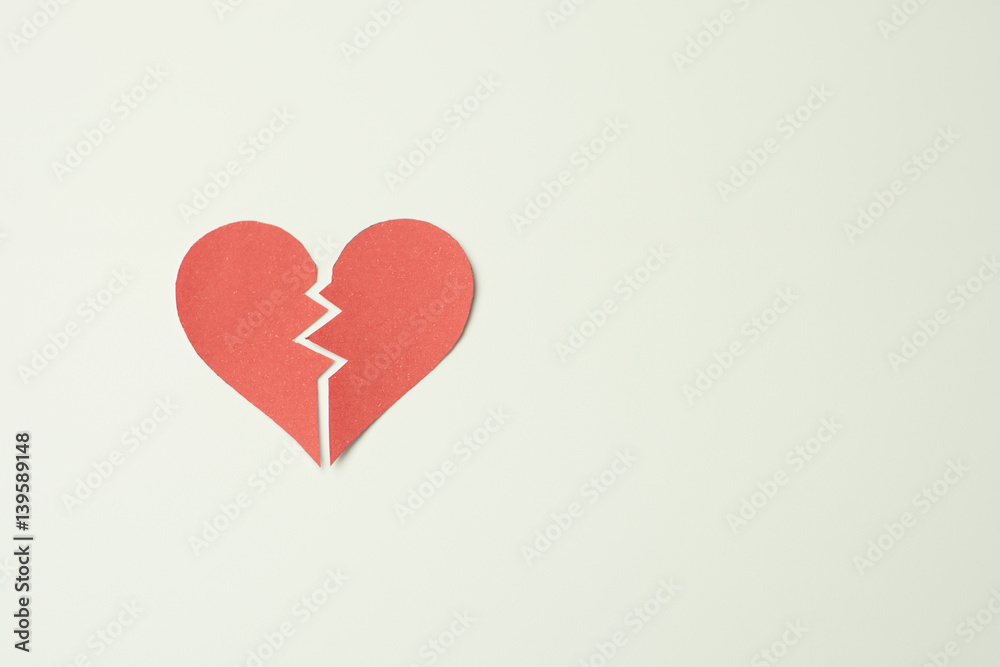 Red paper broken heart on white background Red paper broken heart on white background