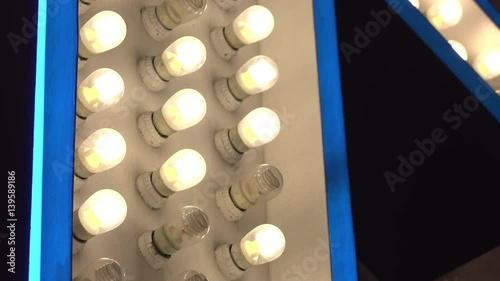 Energy efficient mini bulbs flashing on billboard sign.
