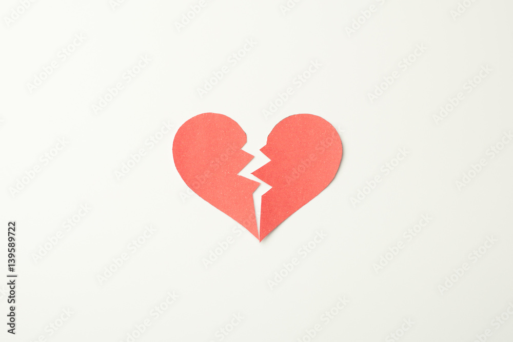 Red paper broken heart on white background Red paper broken heart on white background