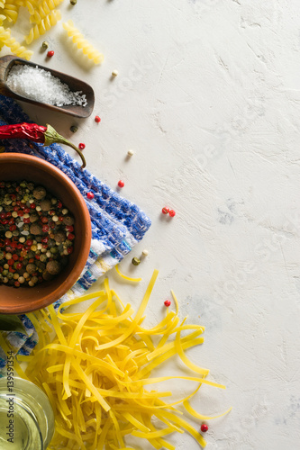 Bright picture with different varieties of pasta and Lasha. Spices and seasonings for cooking. photo