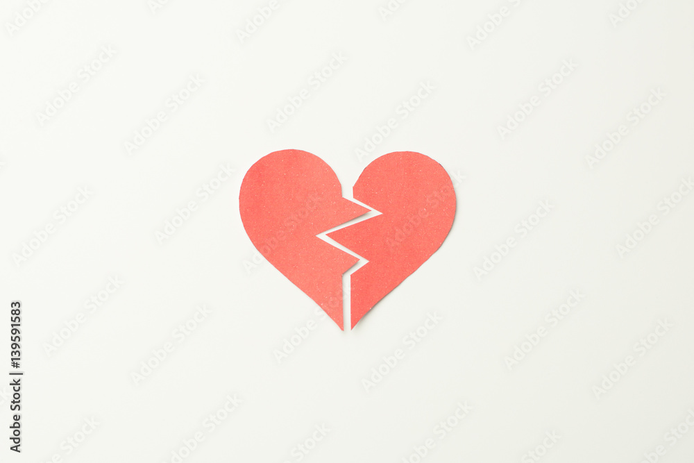 Red paper broken heart on white background Red paper broken heart on white background