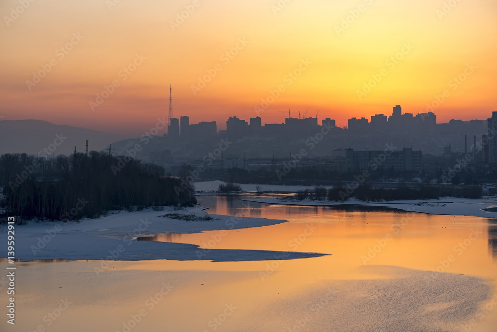 An amazing sunset over Yenisei river and Krasnoyarsk city in Siberia