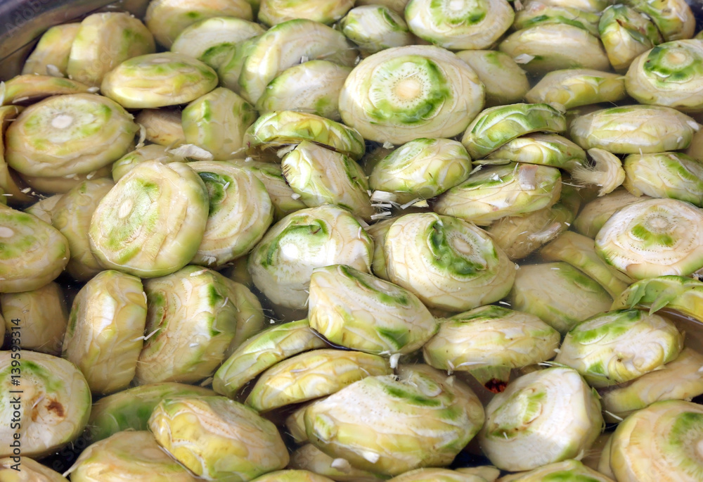 clean bottoms of artichokes prepared by the cook in the water clean bottoms of artichokes prepared by the cook in the water
