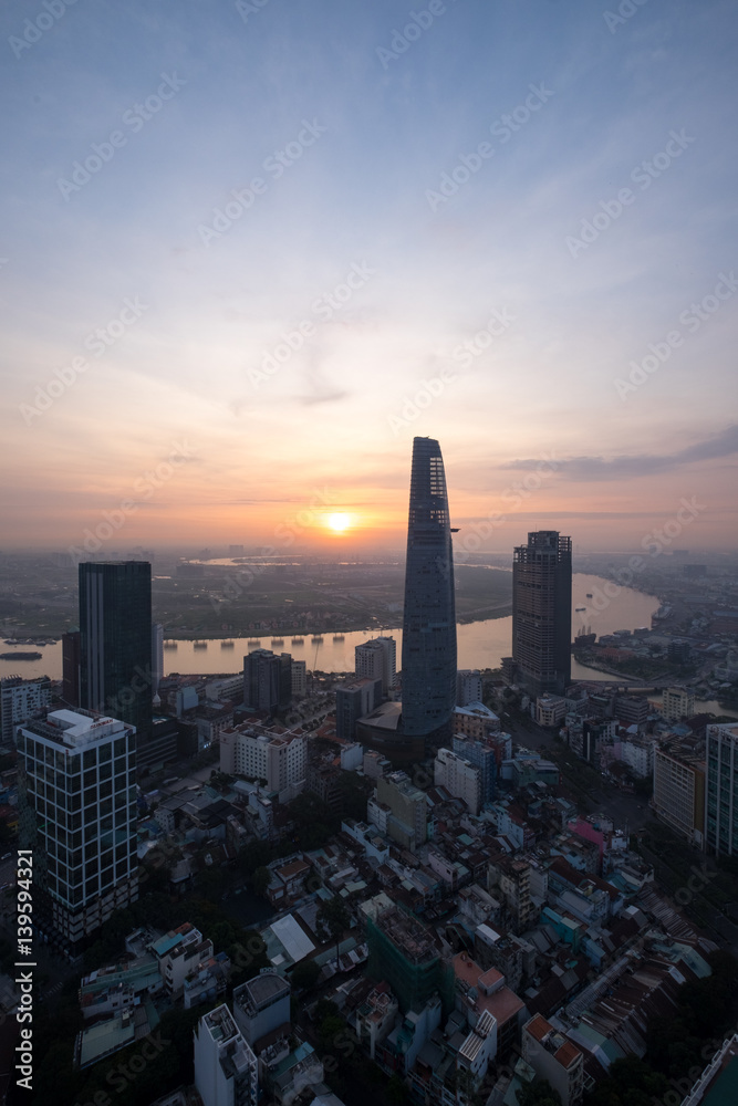 Fototapeta premium Ho Chi Minh city, Vietnam - February 26, 2017: Aerial view of houses and Business and Sai Gon Center of Ho Chi Minh city