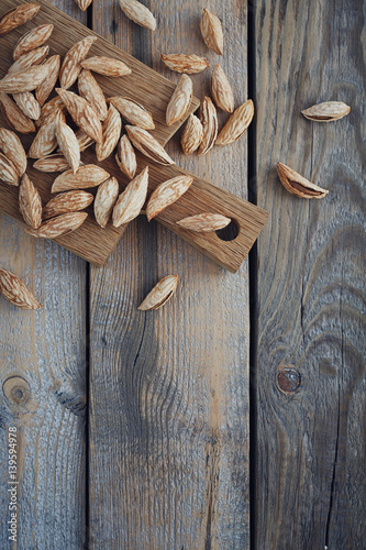 Almonds nuts on a rustic wooden background