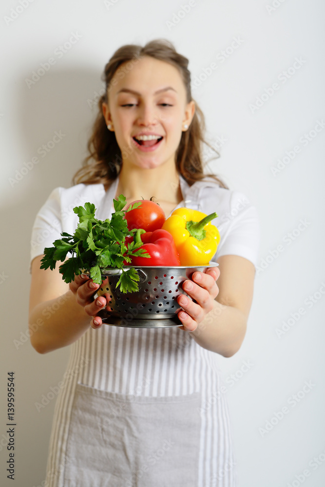 Young joyful chef looks at vegetables, healthy lifestyle. Young joyful chef looks at vegetables, healthy lifestyle.