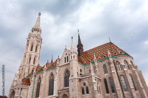St. Matthias Church in the Fisherman's Bastion in Budapest, Hungary. Cloudy weather, dramatic sky © LALSSTOCK