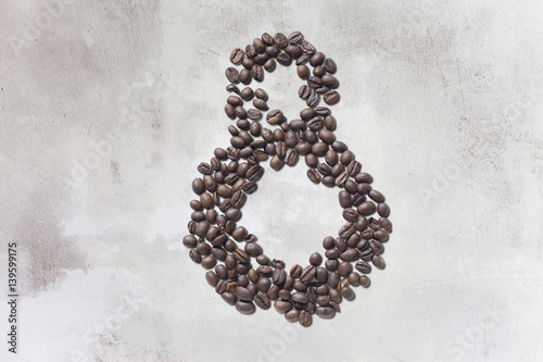 Coffee beans in form of number eight and on beautifull wooden background. International women's day. 8th march