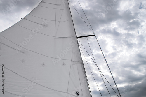 Sail Hoisted Against A Dramatic Sky