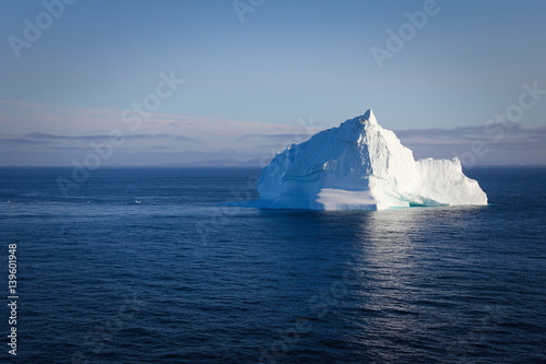 Iceberg floating in calm ocean