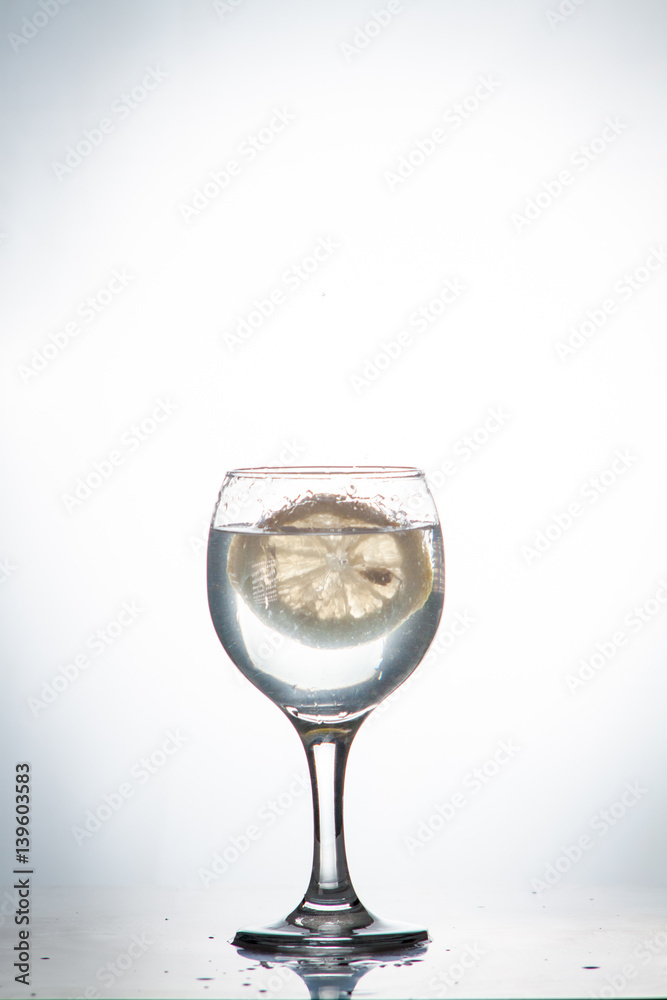 slice of lemon drops in a glass of water slice of lemon drops in a glass of water