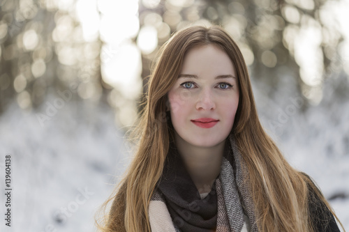 young woman snow walk beauty portrait fun smile candid