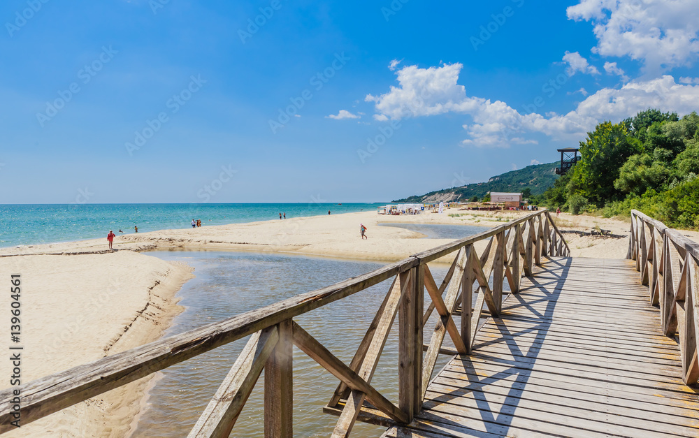 Wooden footbridge over the river. Black Sea Coast,  seaside resort Albena, Bulgaria - obrazy, fototapety, plakaty 