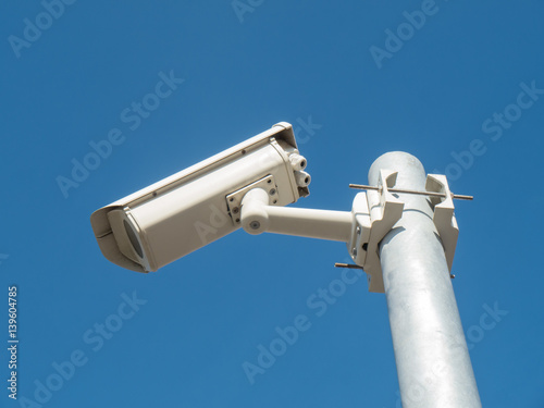 Security camera on blue sky