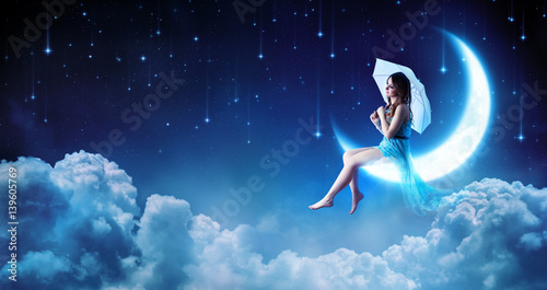 Принти на полотні Dreaming In The Fantasy Night - Fashion Girl Sitting On Moon