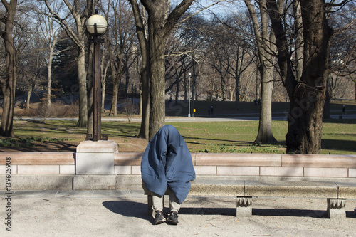 Homeless person sitting in Central Park