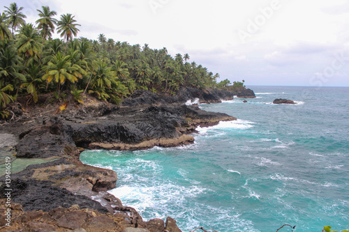 Фотография Beautiful beach with volcanic rocks and clear water in Sao Tome and Principe Isl