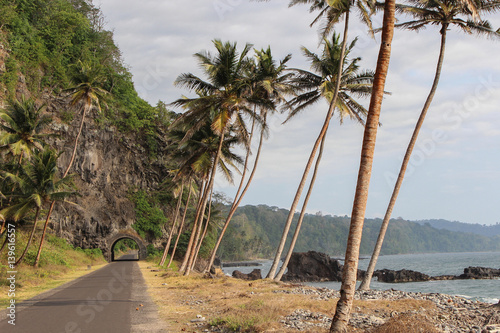 Road to the north of Sao Tome Island  with a historical tunnel and beautiful sea.