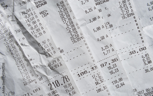 Pile Of Generic Shopping Receipts With Costs photo