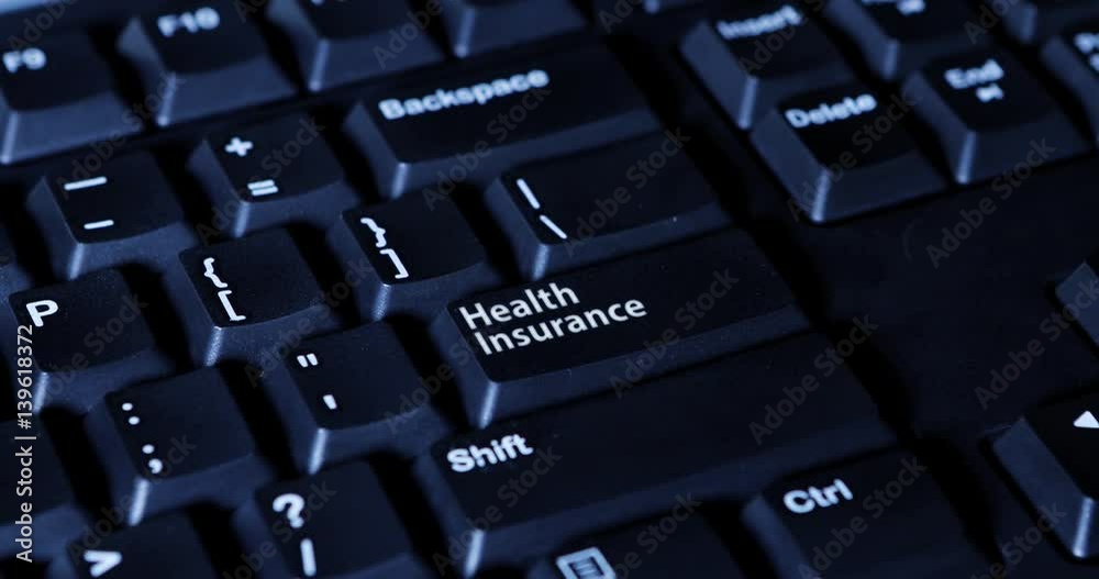 Male hand pressing Health Insurance button on the computer keyboard
Male hand pressing Health Insurance button on the computer keyboard