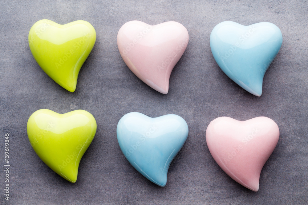 Colored heart on the gray background. View from above. Flat lay.