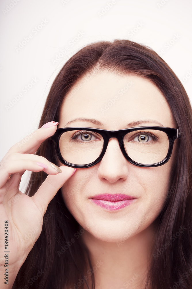 Beautiful young woman wearing glasses close-up isolated on white background. Beautiful young woman wearing glasses close-up isolated on white background.