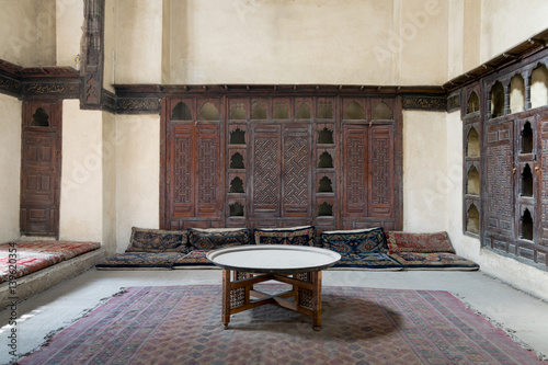 Room at El Sehemy house, an old Ottoman era house in Cairo, built in 1648. with built-in couch, and embedded wooden cupboard, Cairo, Egypt photo