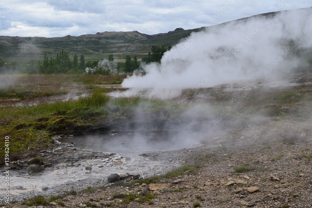 Fire and Ice Iceland geyser burning smoke Fire and Ice Iceland geyser burning smoke