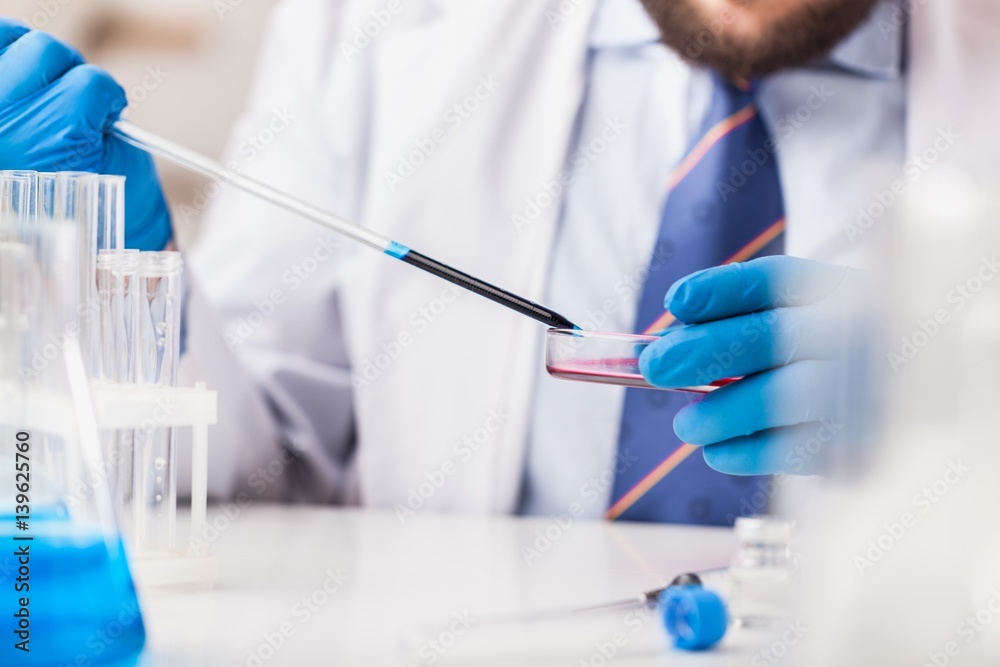 Man researcher carrying out scientific research. Man researcher carrying out scientific research.