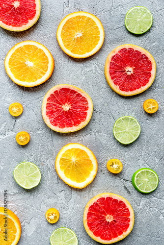 sliced citrus pattern on stone table background top view