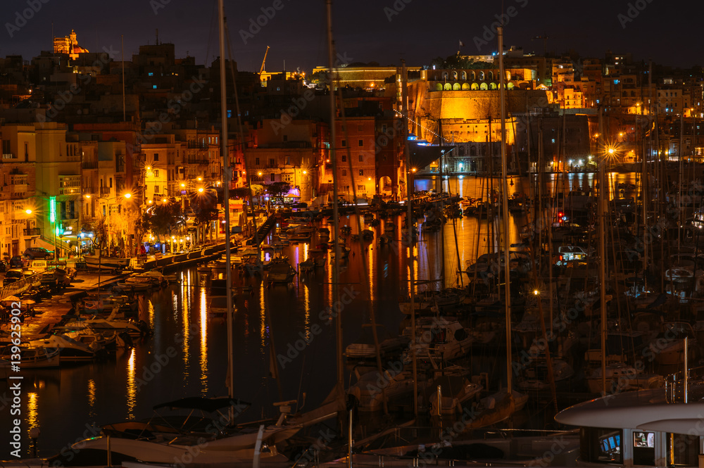 View to marina in Il-Birgu in the evening, Valletta on background