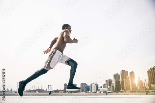 Runner training outdoors © oneinchpunch