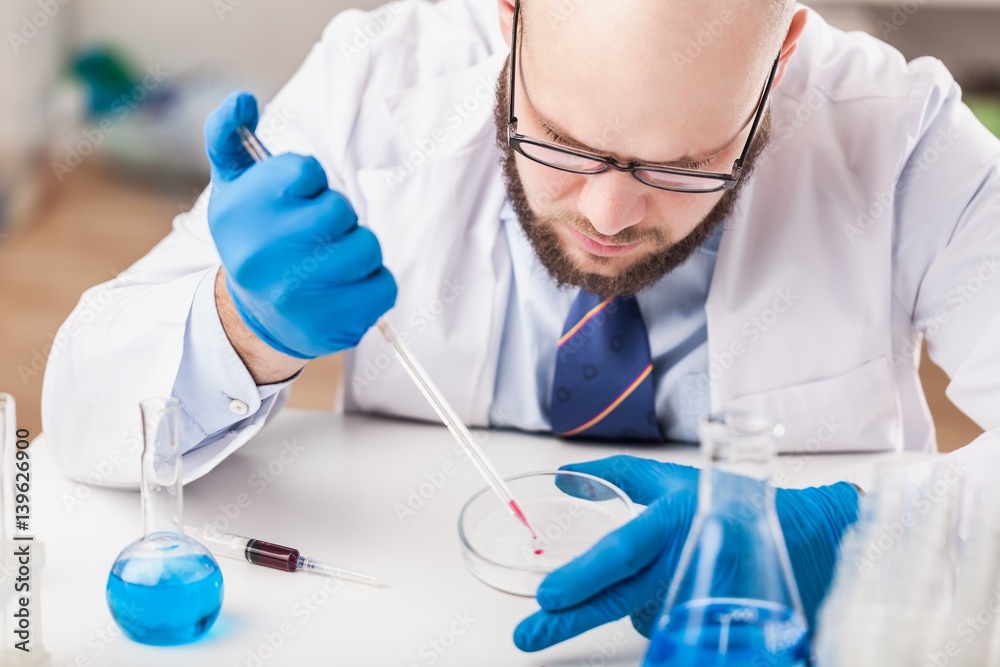 Man researcher carrying out scientific research. Man researcher carrying out scientific research.